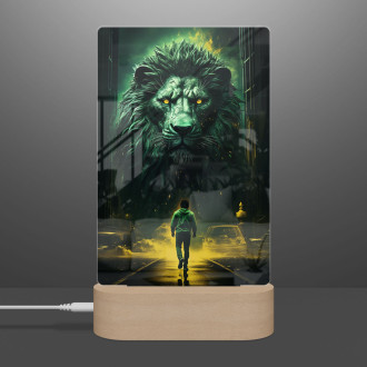 Lamp man walking by a large lion on a dark nigh